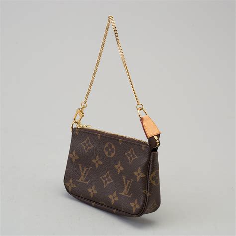 louis vuitton small shoulder bag two pockets leather corner